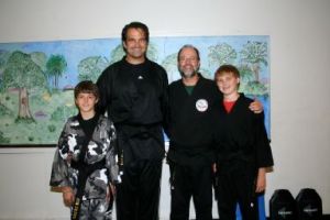 Mark McGee with Black Belts KC, Kyle and Austin Craichy